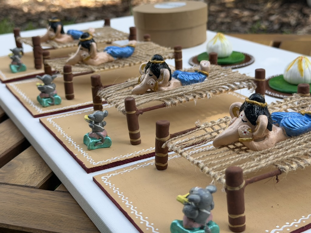 Handmade clay miniature scenes on painted boards
